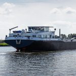 A cargo ship navigating icy northern waters