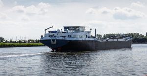 A cargo ship navigating icy northern waters