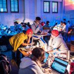 software developers reviewing open source code together