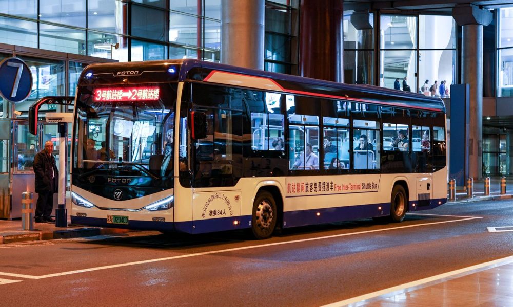 an airport shuttle bus outside a terminal