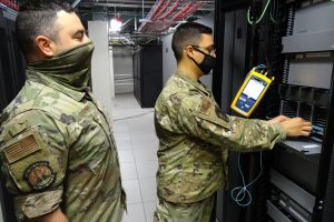technician installing fibre optic cables