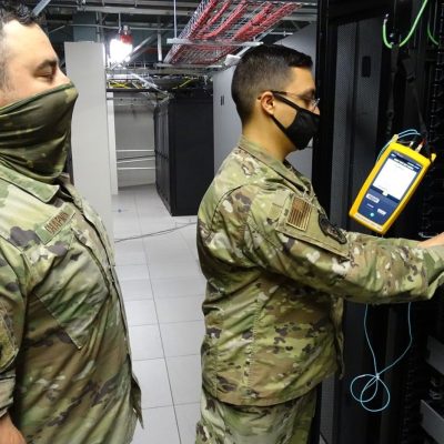 technician installing fibre optic cables